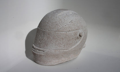 Right side angle of custom-made mini Formula 1 helmet designed with a white natural stone effect. The helmet, crafted to emulate natural stone with a matte finish, adds a sleek and modern touch to any home decor. Available for purchase with customization options on the website.